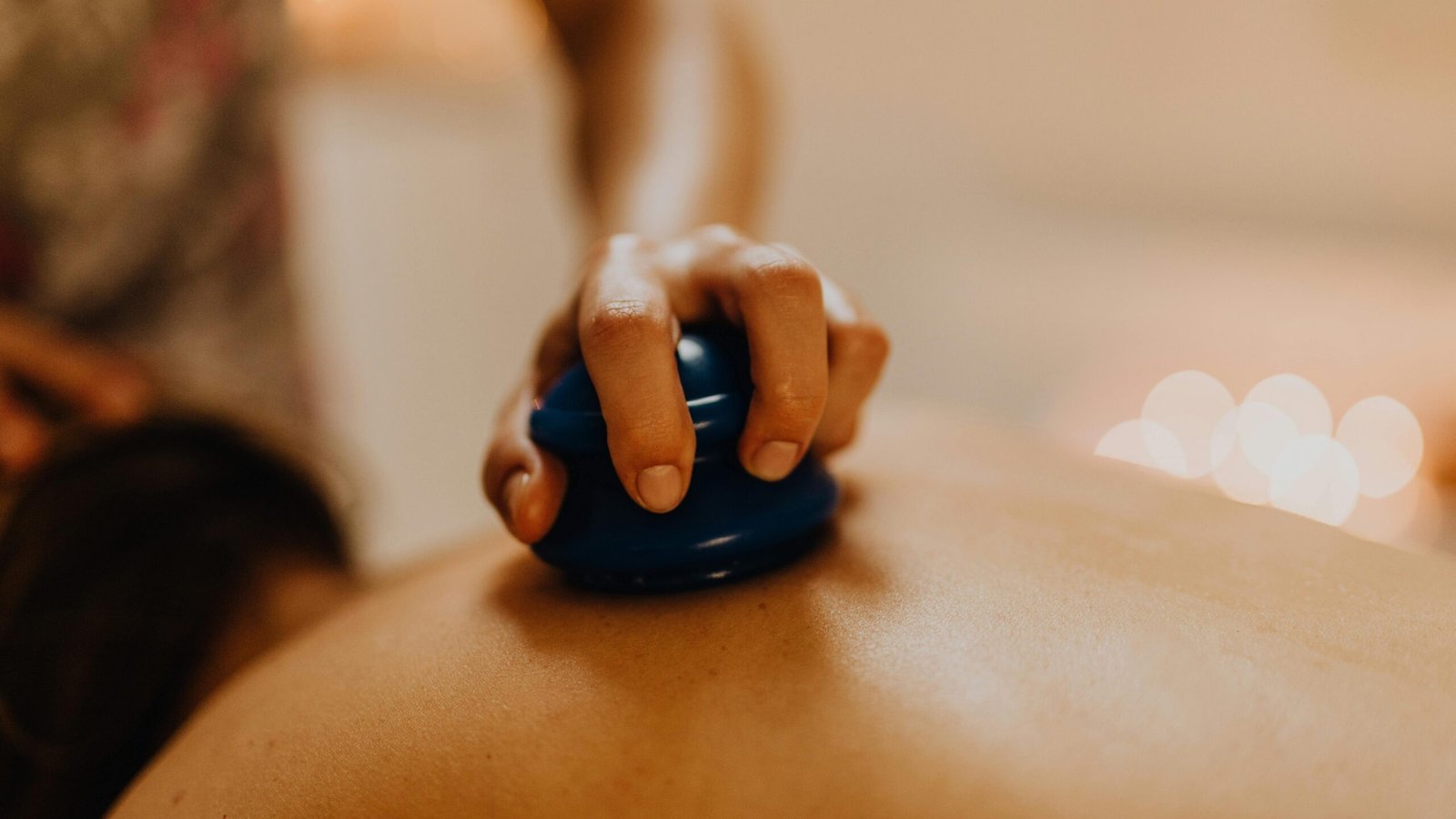 Close-up of cupping therapy on a person's back, focusing on relaxation and wellness.